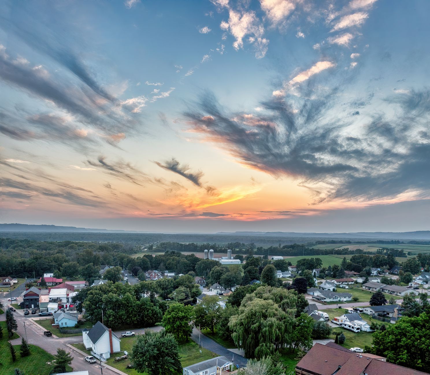 A charming, vibrant small town main street with historic buildings and people strolling, hinting at hidden gems across the USA.