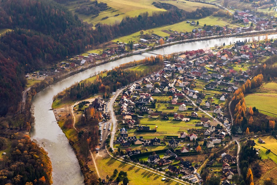 A remote European village perched on a cliff at golden hour