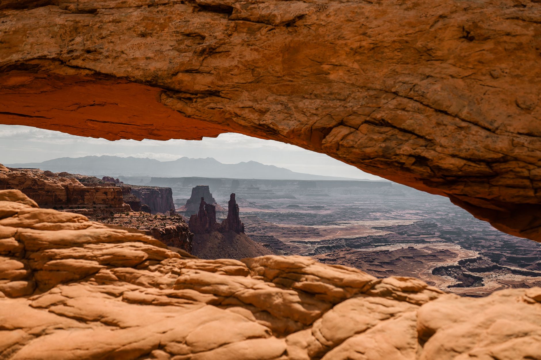 A sweeping view of a remote, less-traveled American landscape, possibly a vast prairie or a unique geological formation, suggesting hidden beauty.
