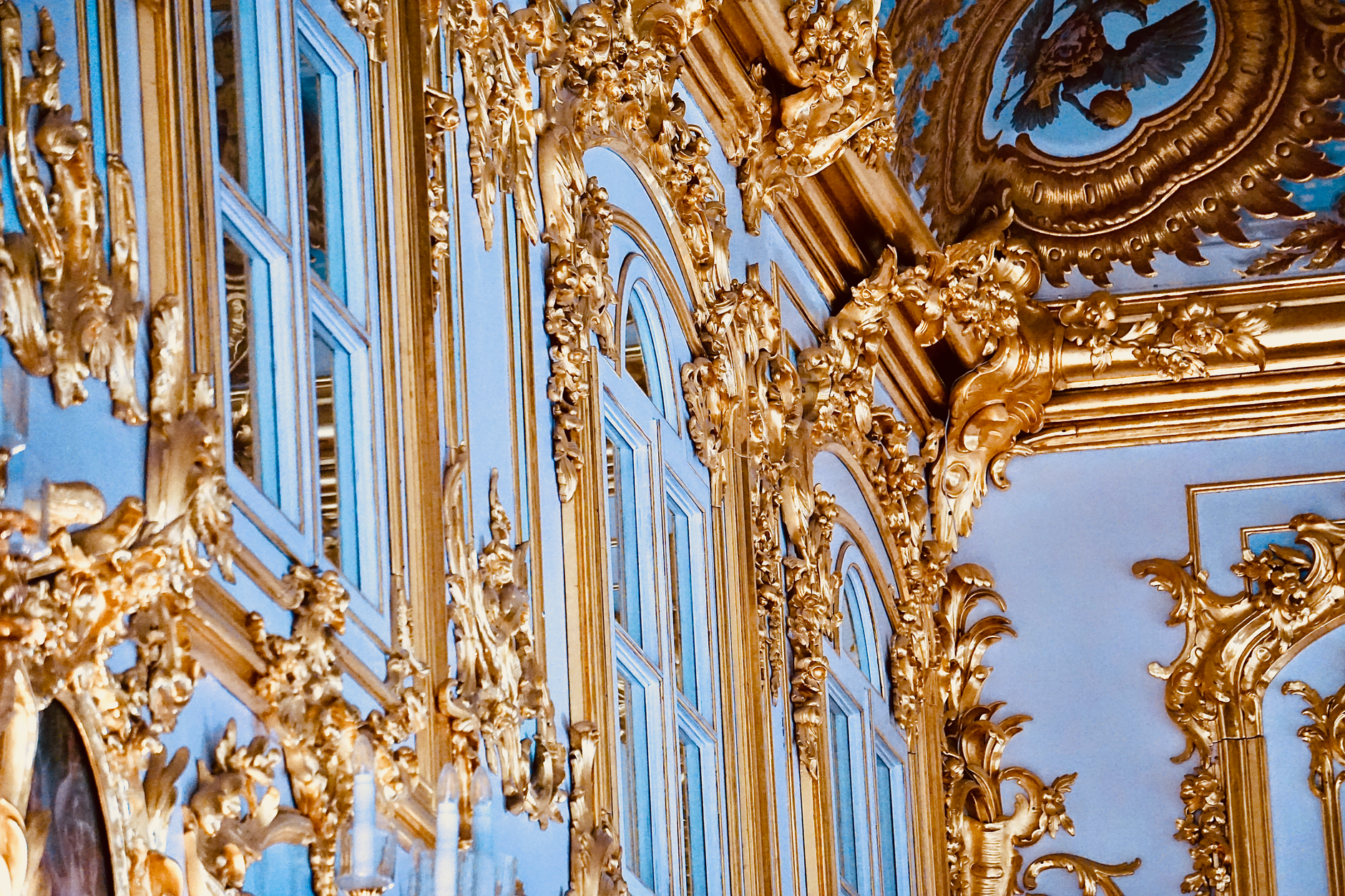 An opulent, richly decorated interior of a historic Polish palace, possibly housing an art collection, with intricate architectural details and antique furnishings.