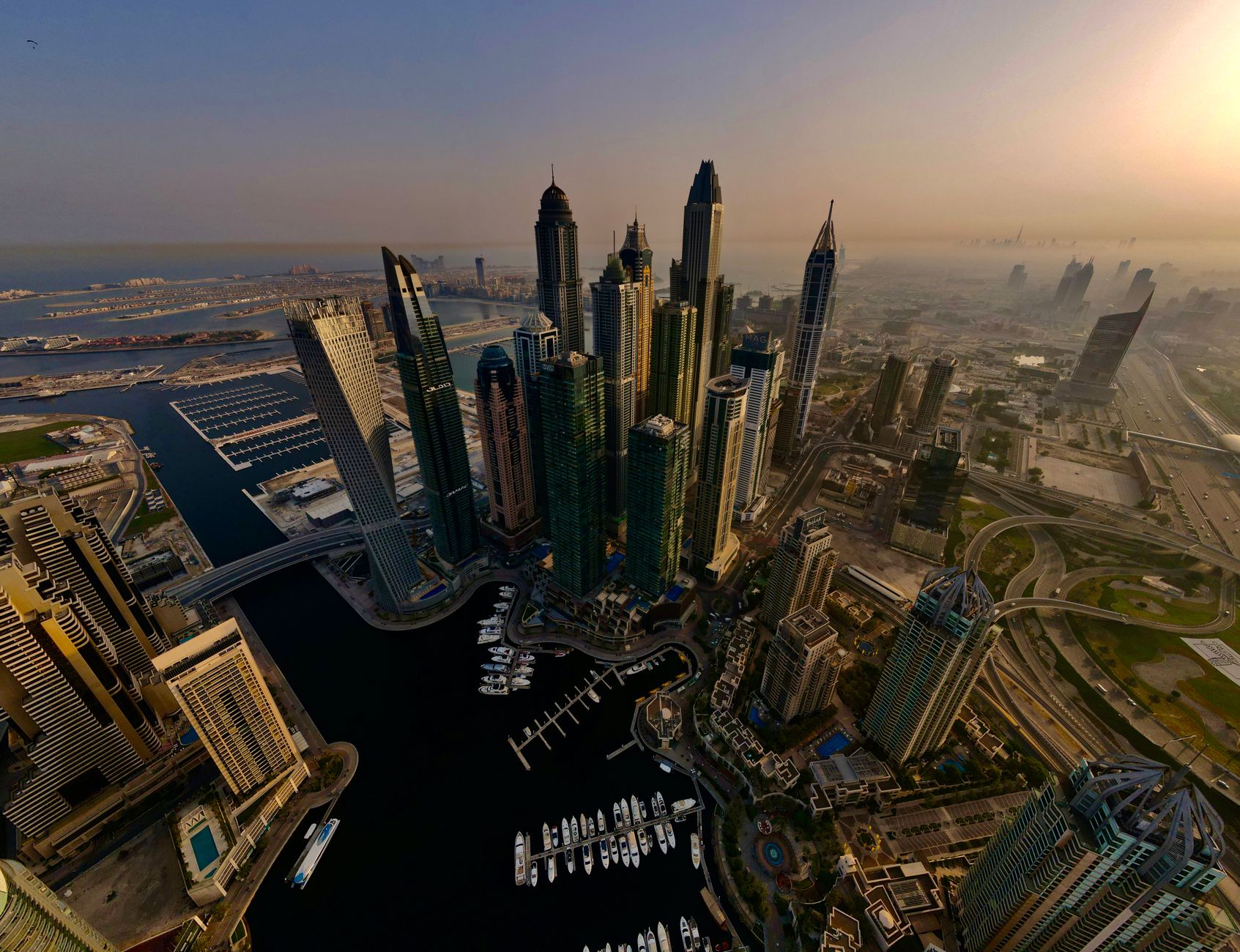 Aerial view of a modern, green city with skyscrapers, parks, and efficient transportation, symbolizing advanced urban planning.