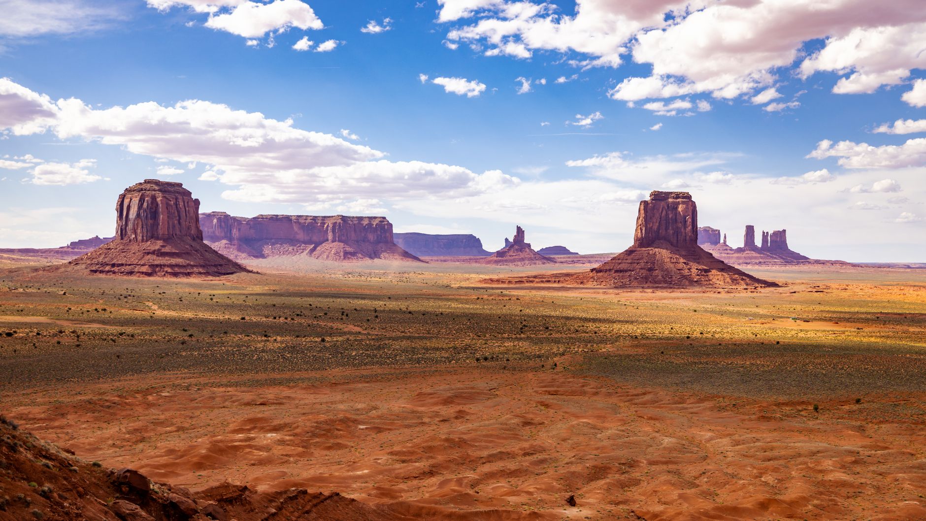 Sweeping panorama of a remote national park landscape under a dramatic sky, evoking a sense of adventure and discovery.