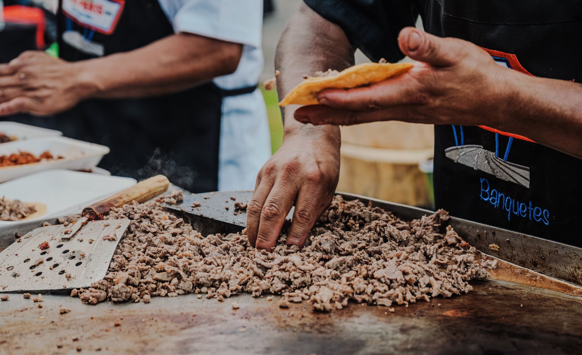 A vibrant array of diverse American tacos and street food, showcasing different fillings and tortilla styles, suggesting a journey through the country's unique culinary traditions.