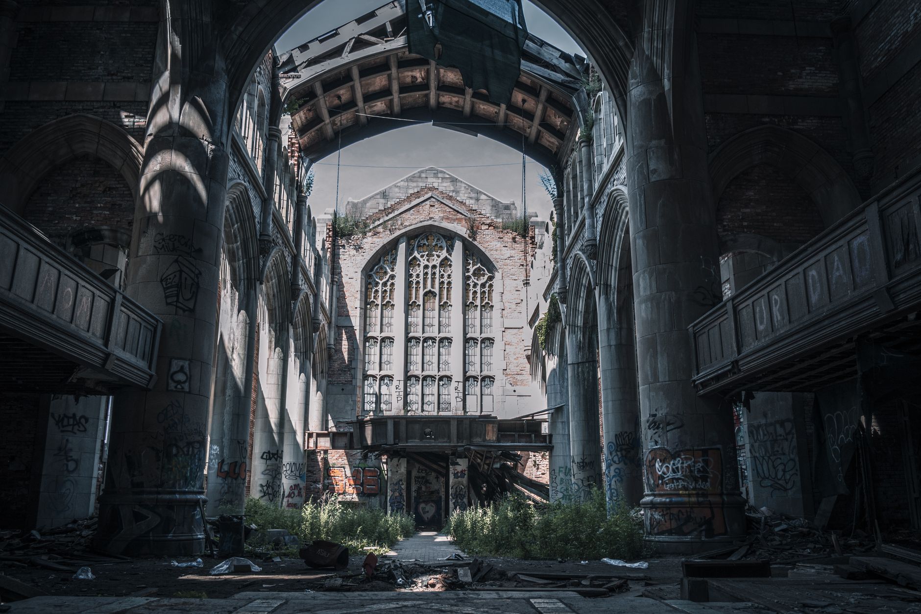 A sweeping view of an eerie, abandoned landscape with forgotten structures, hinting at hidden stories and past events.