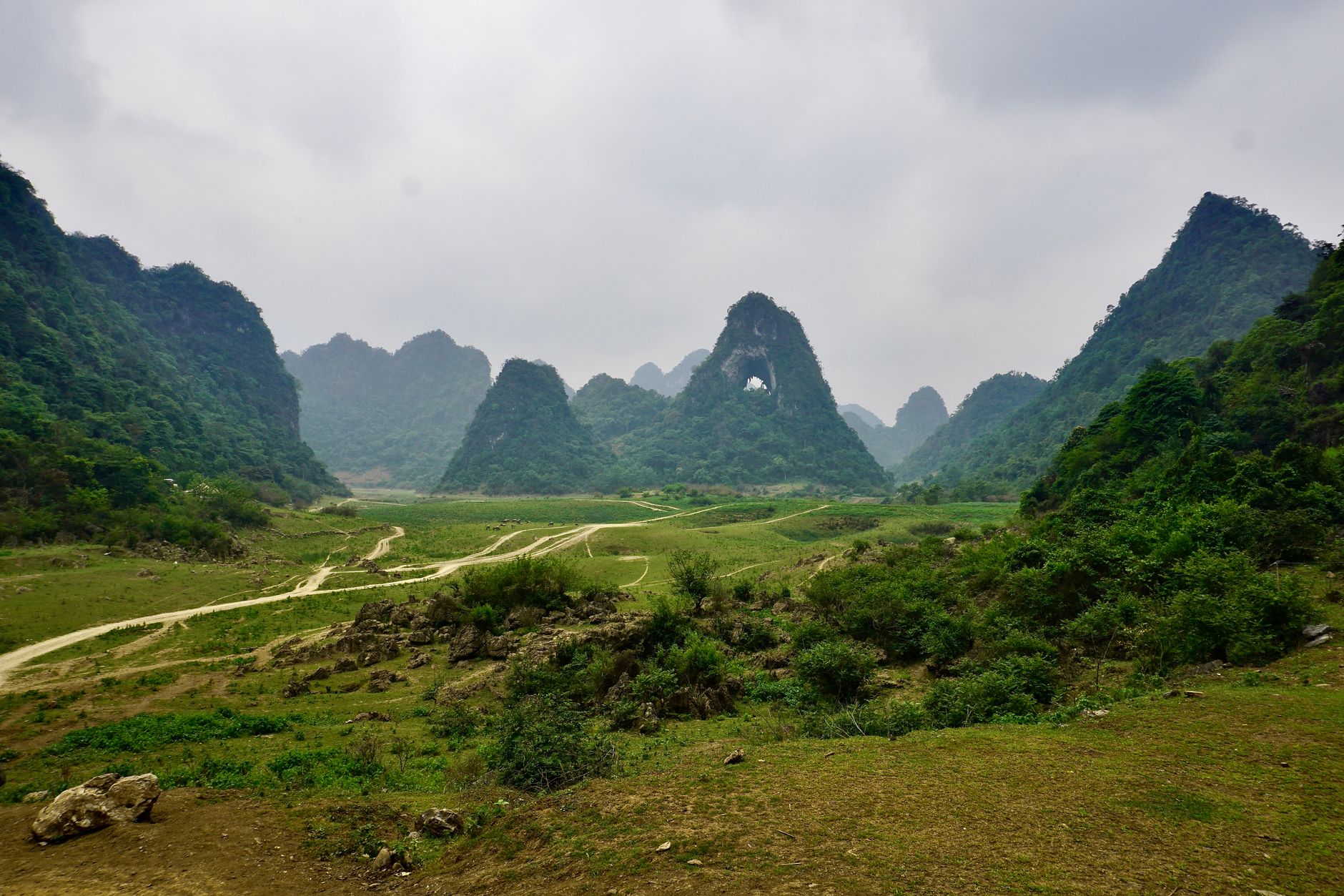 An expansive aerial view of a dramatic and unique landscape, hinting at ancient mysteries or unusual geological formations, inviting exploration.