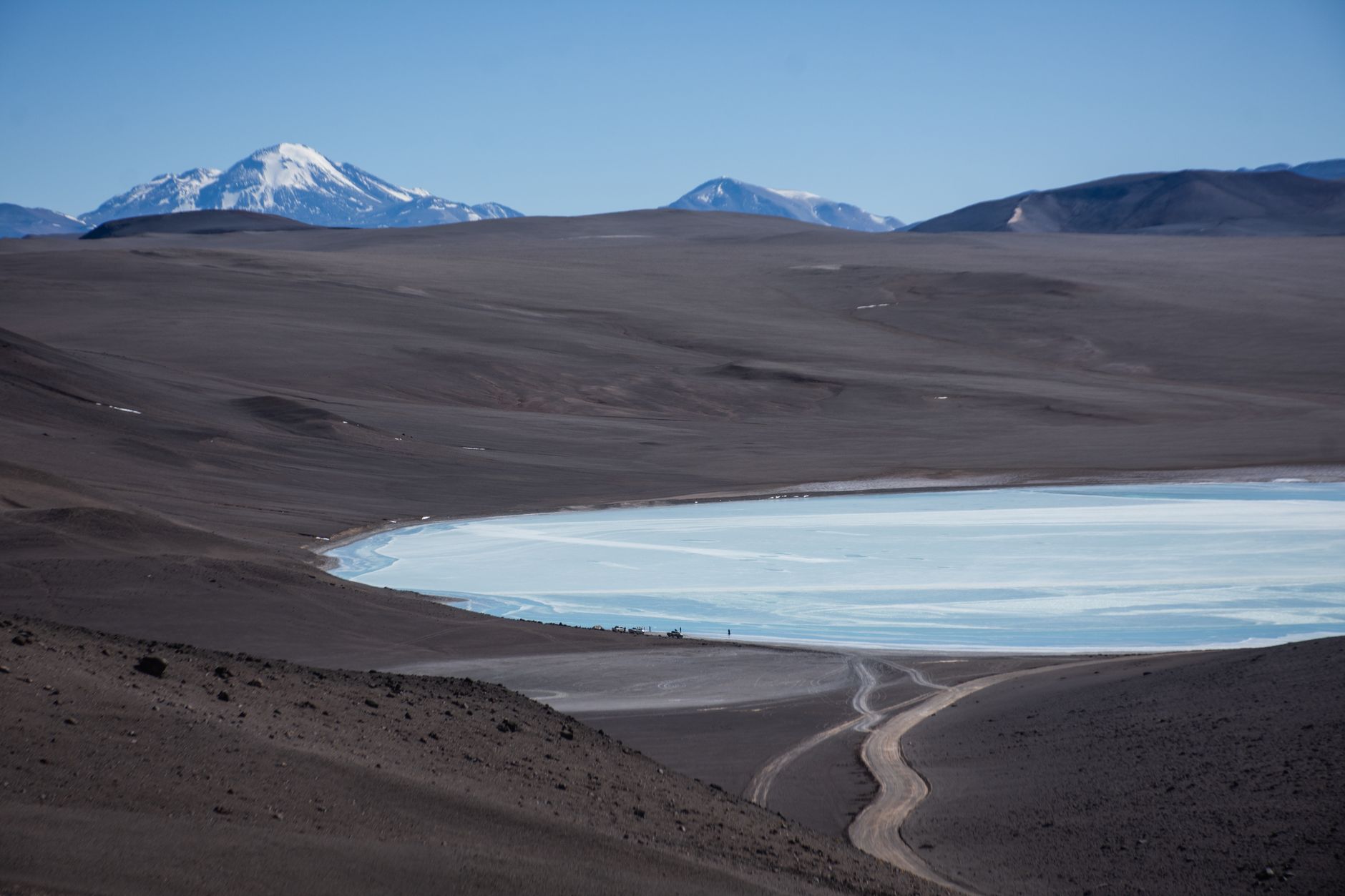 A sweeping view of varied global landscapes, from arid deserts to green islands and ancient stone cities, representing diverse travel destinations.