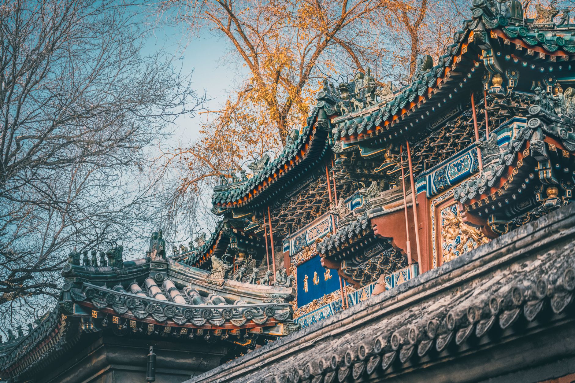 Misty mountains overlooking an ancient East Asian temple complex, evoking a sense of shared history and cultural exchange across the region.